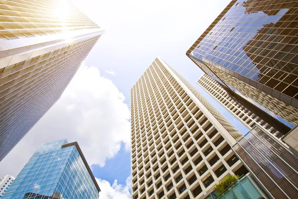 Home depositphotos 44284529 low angle shot of modern glass city buildings